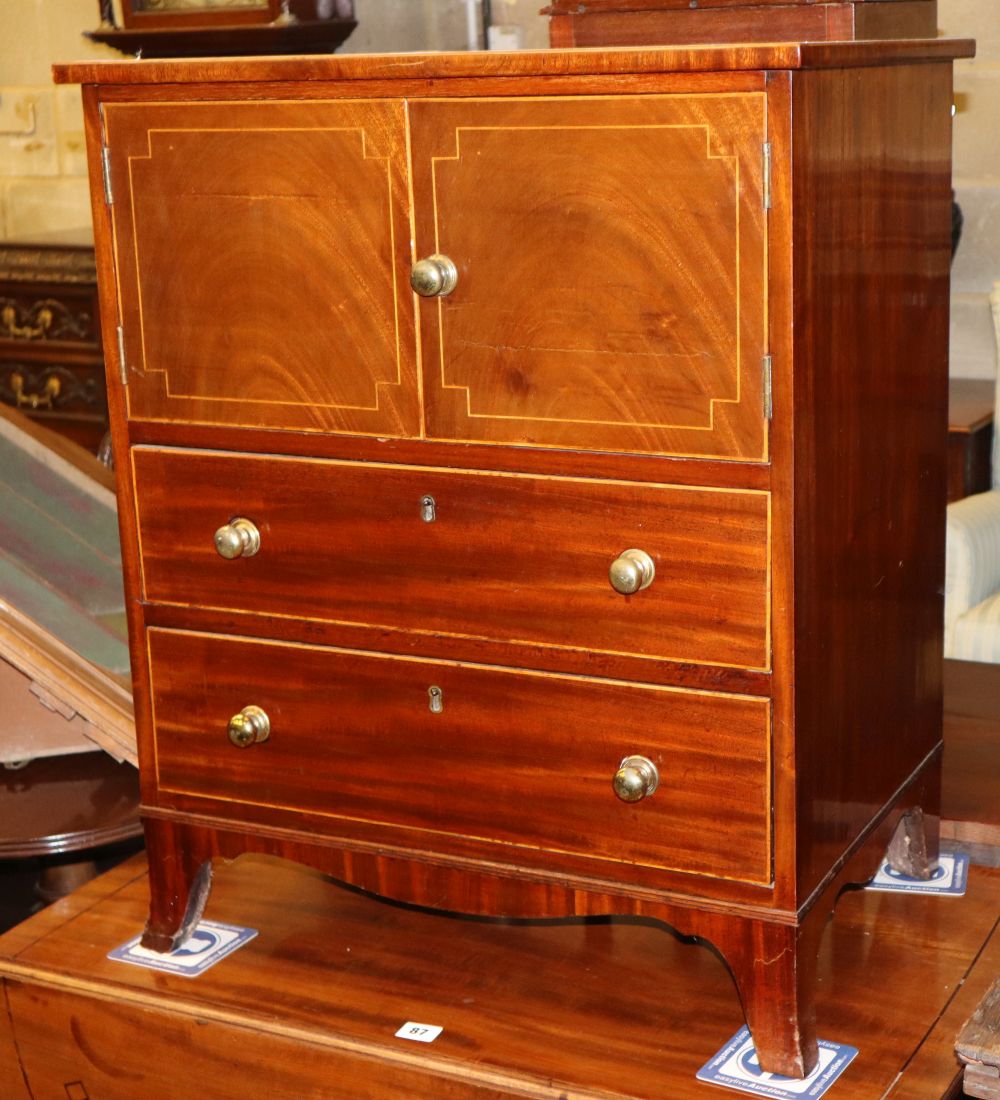 A Regency inlaid mahogany cabinet, fitted doors and two drawers, (formerly a commode chest), W.61cm